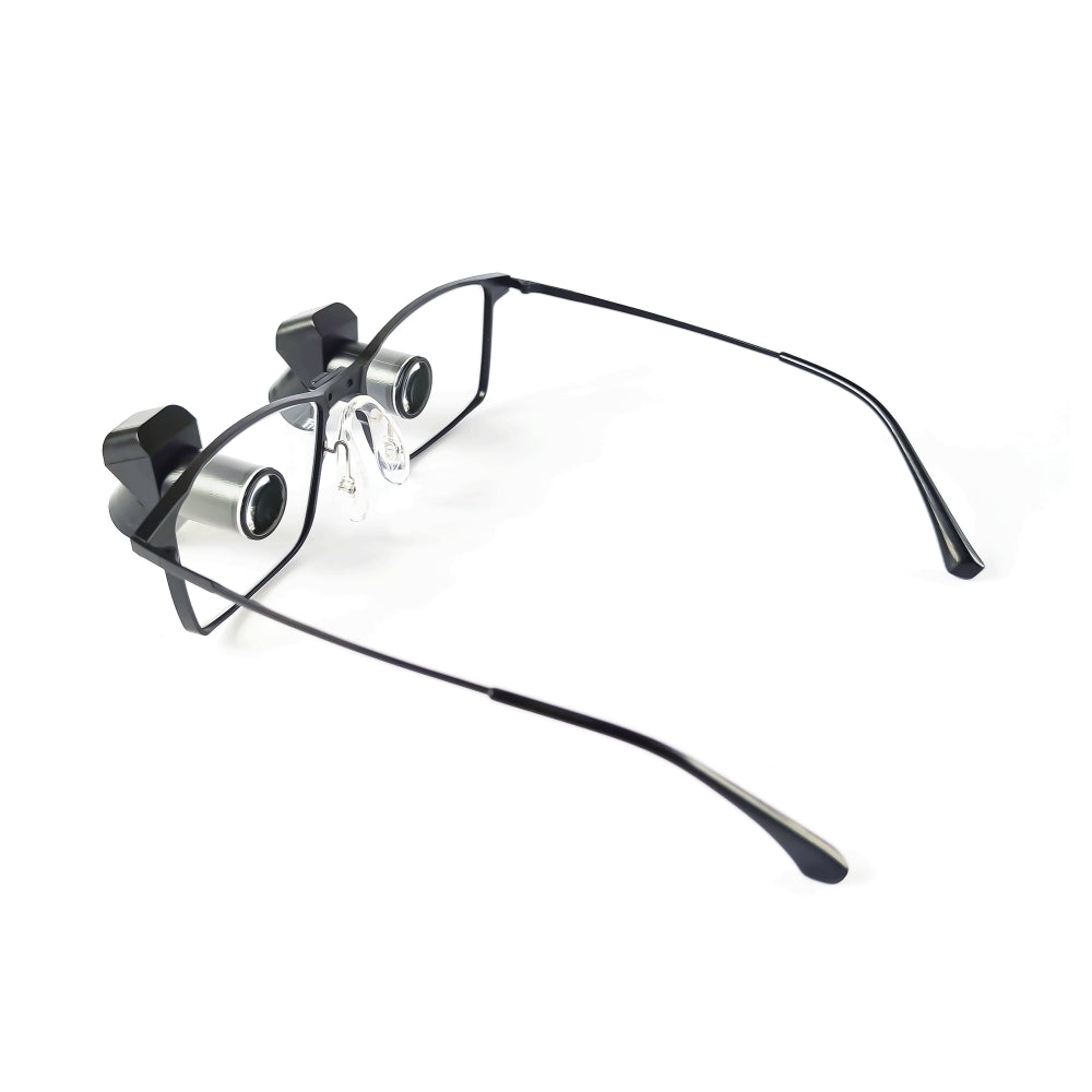 Back view of Oradenix premium ergonomic TTL dental loupes, showcasing the A+ grade optical glass eyepieces seamlessly integrated into the lenses. The image highlights the comfortable nose pads and ultra-lightweight aerospace titanium frame on a white background.