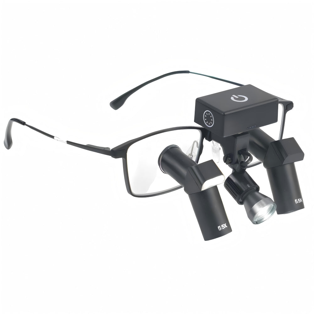 A high-resolution close-up showcasing the seamless integration of the Oradenix® wireless surgical LED headlight securely mounted on a pair of black 5.5X Ergo TTL dental loupes. The detailed view highlights the compact, rectangular touch-control battery unit resting perfectly balanced on the frame's bridge. Just below, the articulated LED lamp head is precisely aligned with the downward-angled 5.5X ergonomic deflection oculars. This setup demonstrates how the illumination path perfectly matches the clinician