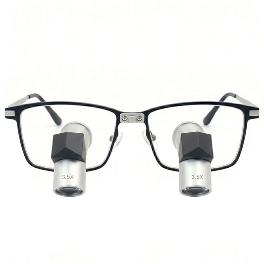 Front view of Oradenix premium TTL loupes featuring elegant silver-white metal lens barrels with 3.5x magnification marking, integrated into a sleek black and silver aerospace-grade titanium frame isolated on a pure white background. Designed for ergonomic posture and high-precision professional laboratory work.